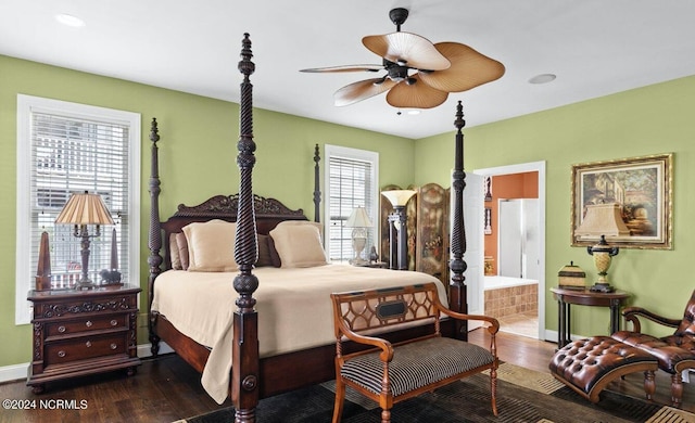 bedroom with multiple windows, dark hardwood / wood-style flooring, ceiling fan, and ensuite bathroom