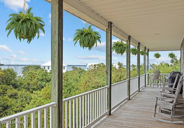 wooden deck with a water view