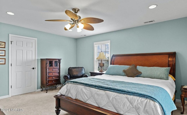 bedroom with light carpet and ceiling fan