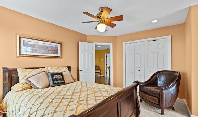 carpeted bedroom featuring ceiling fan and a closet