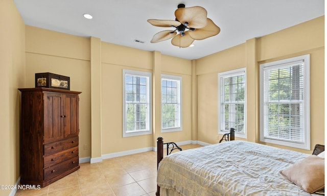 bedroom with ceiling fan and light tile patterned flooring