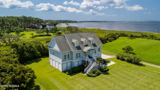 birds eye view of property featuring a water view