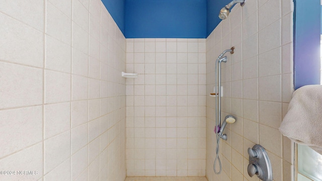 bathroom with a tile shower