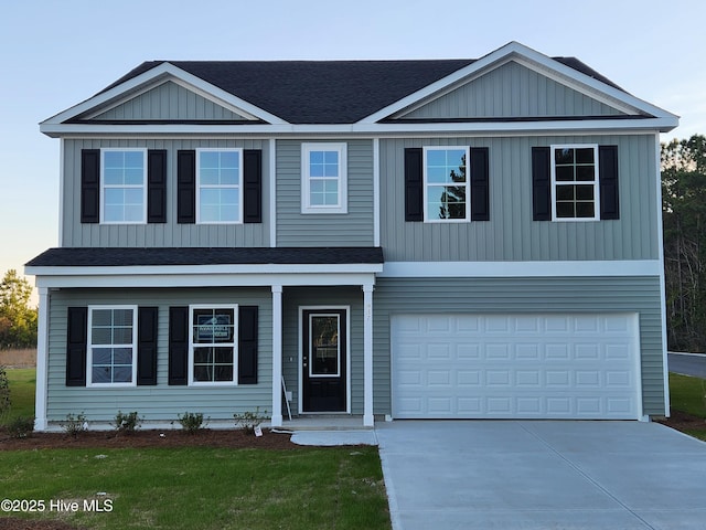 view of front of house featuring a garage, a shingled roof, driveway, and board and batten siding