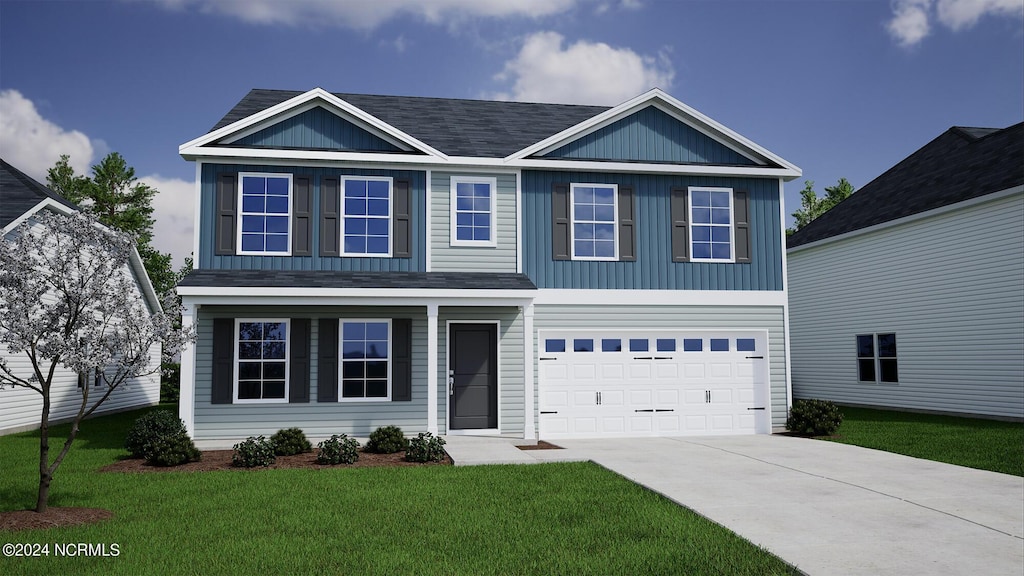 view of front facade with a garage, concrete driveway, and a front yard