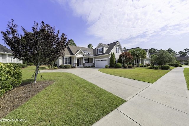 view of front of property with concrete driveway and a front lawn