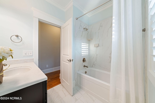 bathroom with marble finish floor, shower / bathtub combination with curtain, ornamental molding, vanity, and baseboards