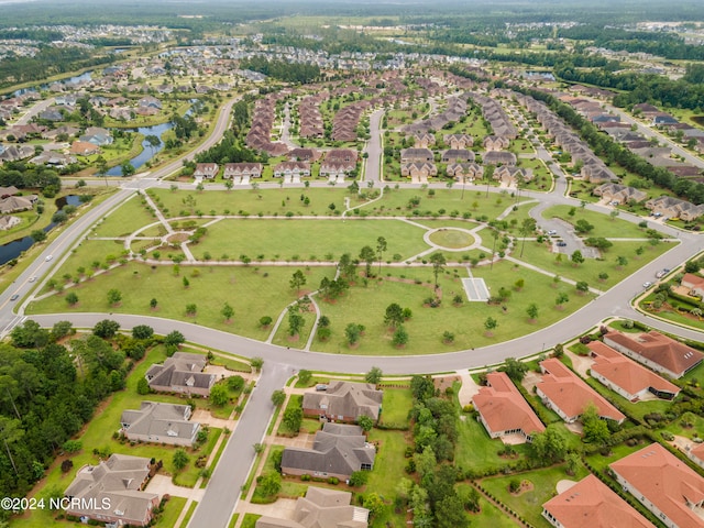 birds eye view of property with a water view and a residential view