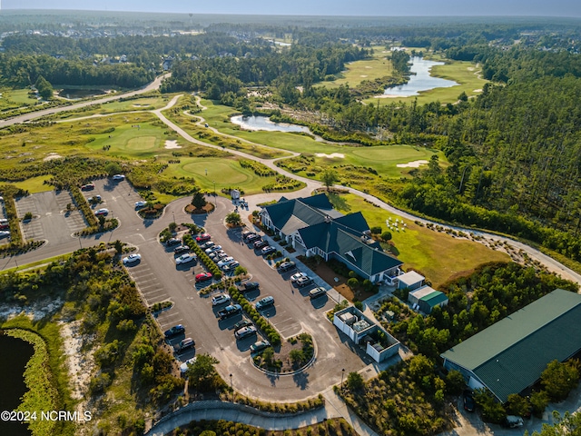 bird's eye view with view of golf course and a water view