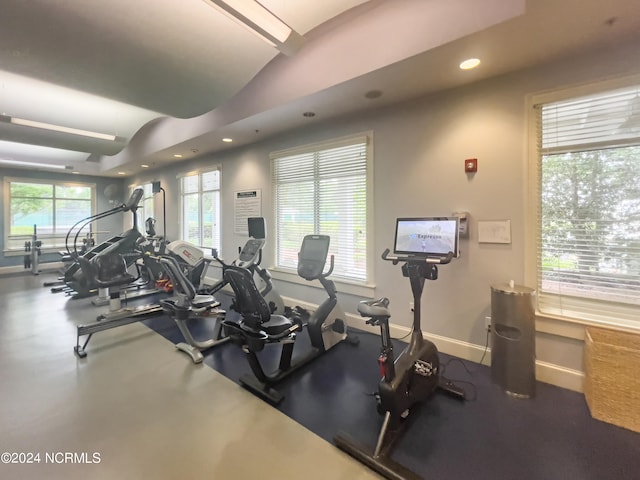 exercise room featuring plenty of natural light, baseboards, and recessed lighting