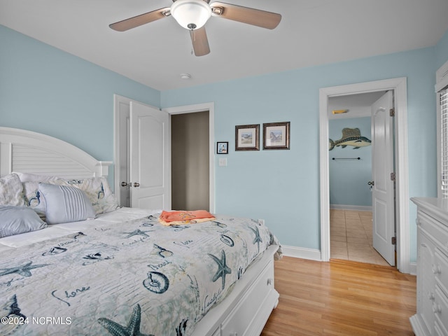 bedroom featuring light hardwood / wood-style floors and ceiling fan