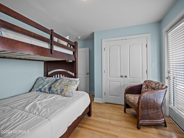 bedroom featuring a closet and light wood-type flooring