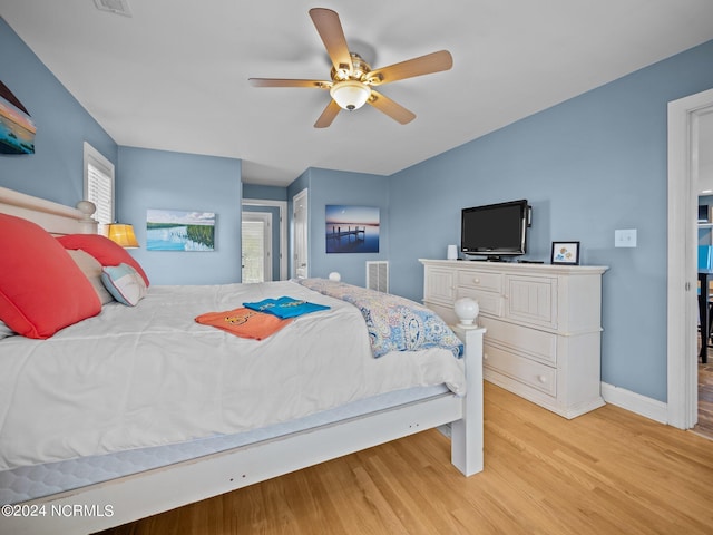 bedroom featuring ceiling fan and light hardwood / wood-style flooring