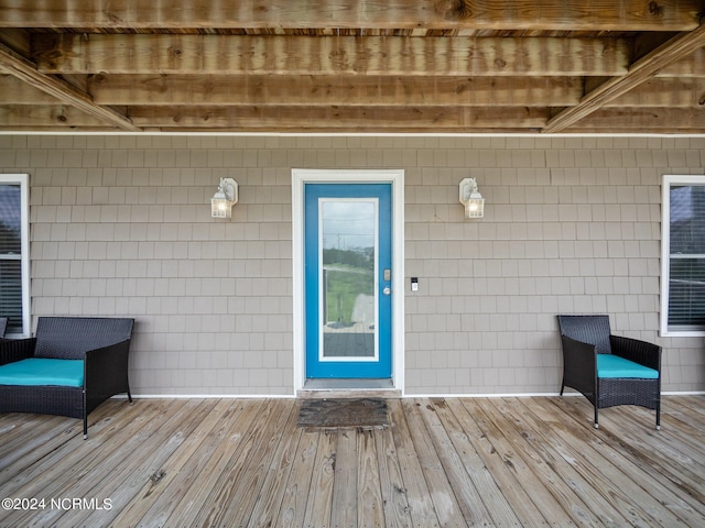 property entrance with a deck