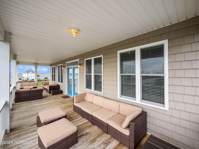 wooden deck with an outdoor hangout area