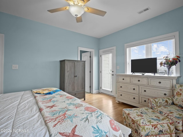 bedroom featuring light hardwood / wood-style flooring and ceiling fan