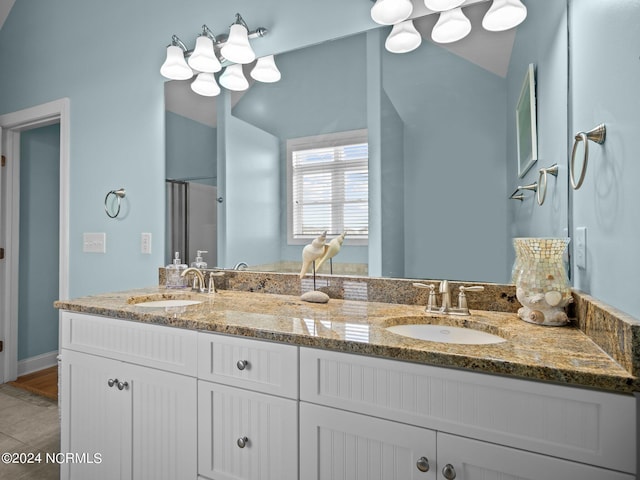 bathroom with vanity and an enclosed shower