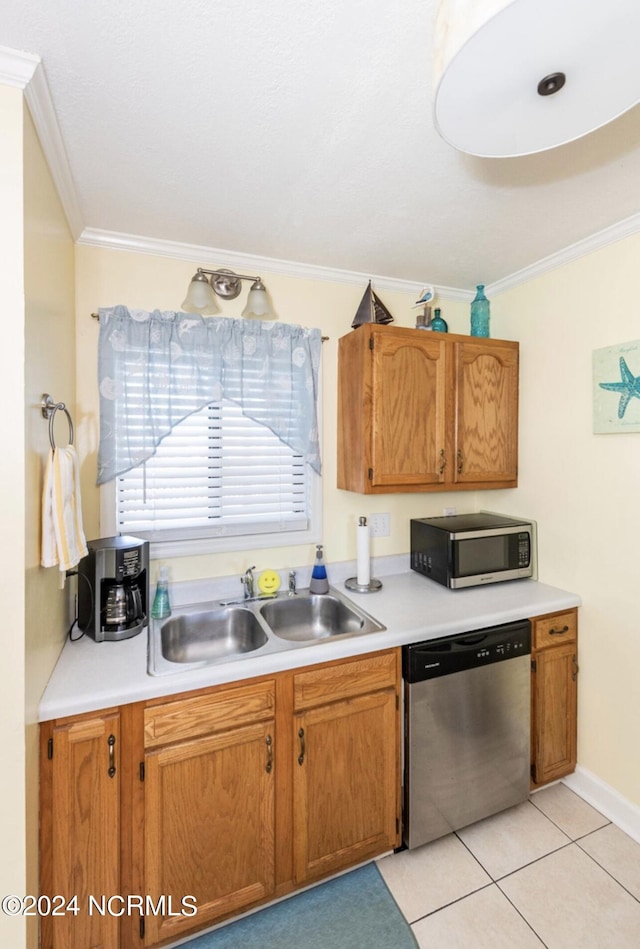 kitchen featuring stainless steel appliances, crown molding, sink, and light tile patterned floors