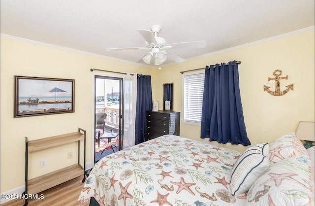 bedroom featuring multiple windows, crown molding, access to exterior, and ceiling fan