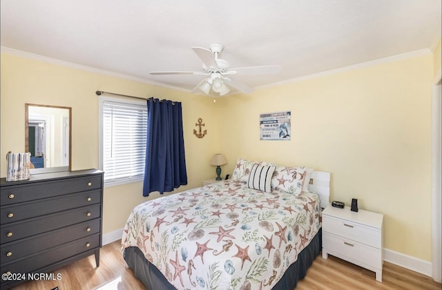 bedroom with ceiling fan, ornamental molding, and light hardwood / wood-style floors