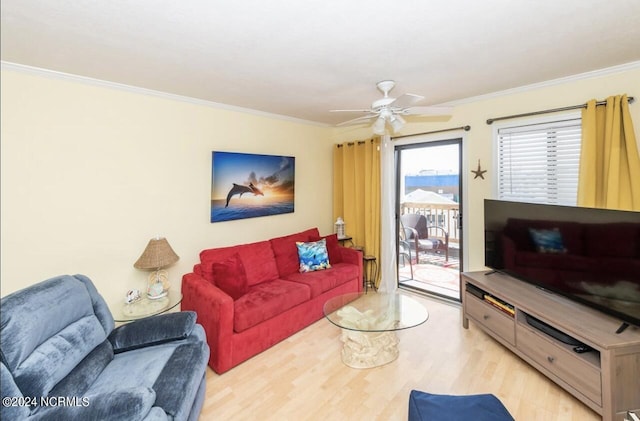 living room with ceiling fan, ornamental molding, and light wood-type flooring