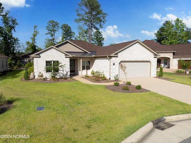 ranch-style house with a garage and a front lawn