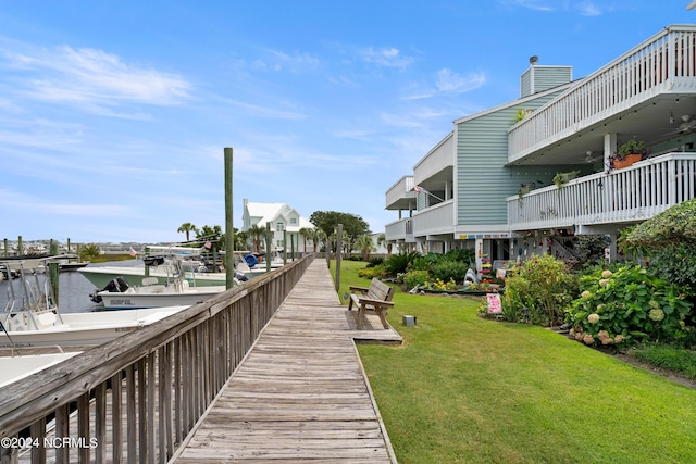 view of dock featuring a yard