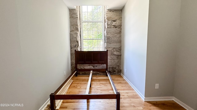 unfurnished bedroom featuring baseboards and light wood finished floors