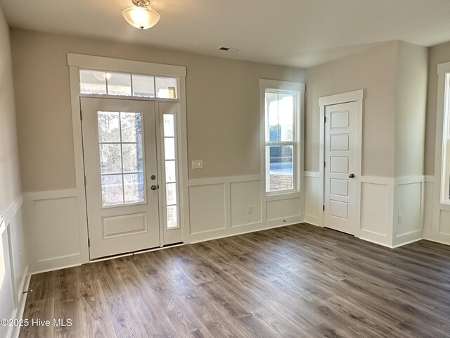 entryway with dark hardwood / wood-style floors