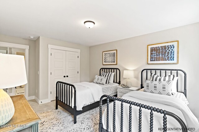 carpeted bedroom featuring a closet