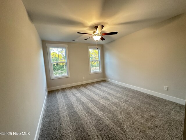 spare room with ceiling fan and carpet floors