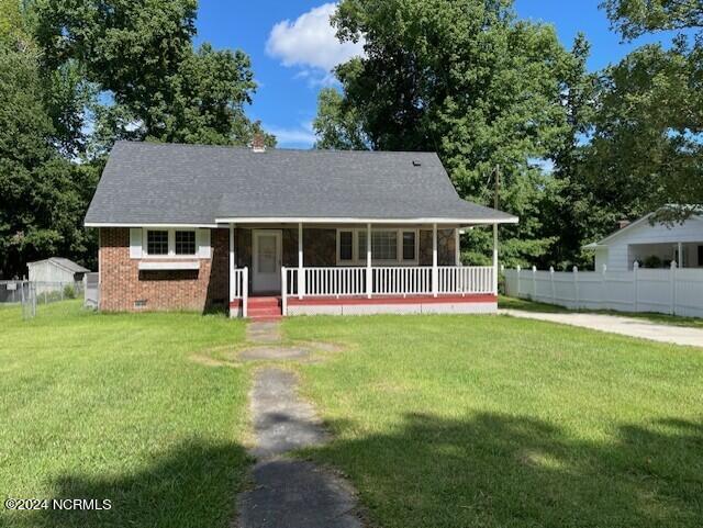 view of front of house featuring a front lawn and a porch