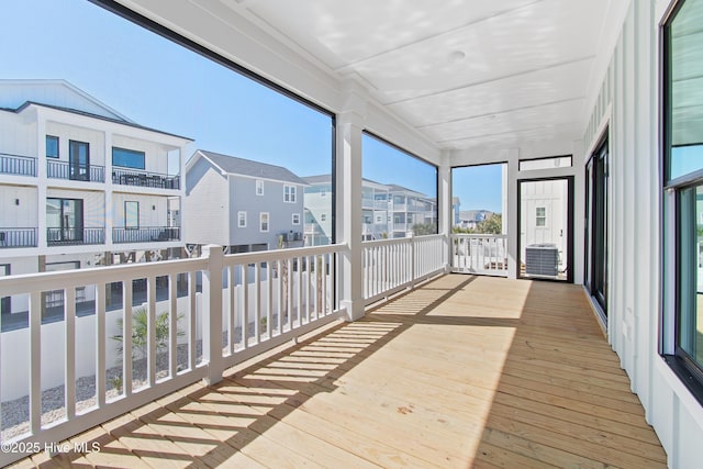 sunroom featuring a residential view