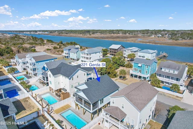 bird's eye view featuring a residential view and a water view