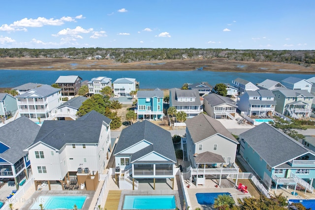 aerial view featuring a residential view and a water view