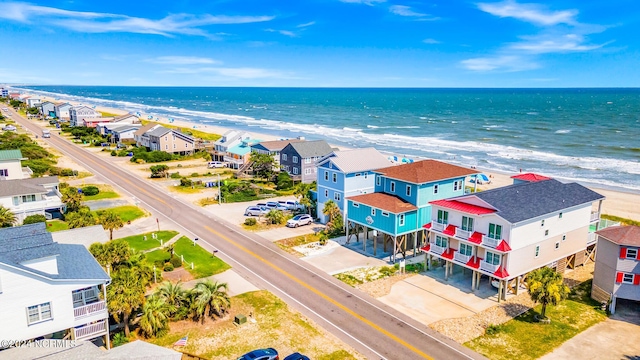 bird's eye view with a water view and a view of the beach