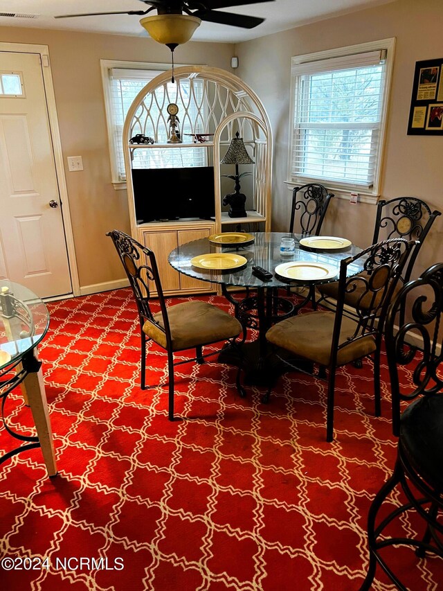 dining space featuring ceiling fan