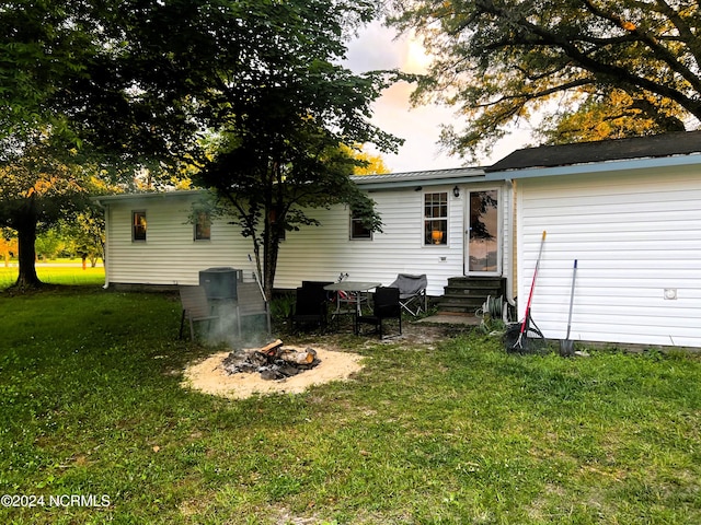 rear view of house with a lawn