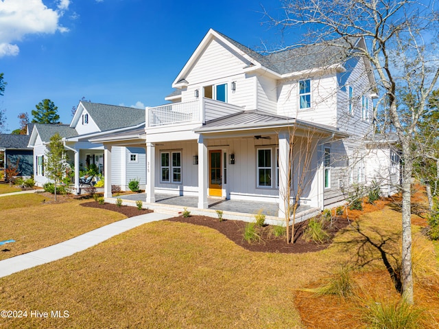 view of front of property featuring covered porch, a shingled roof, and board and batten siding