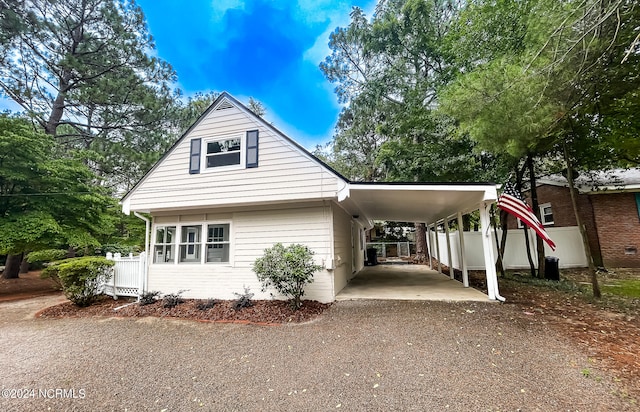 view of front facade with a carport