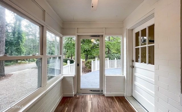 unfurnished sunroom with plenty of natural light