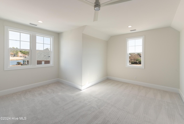 bonus room with light carpet, ceiling fan, and lofted ceiling