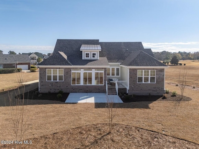 rear view of property with a patio