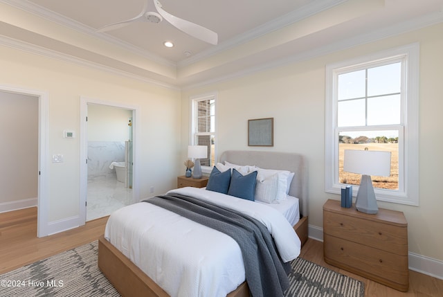 bedroom featuring connected bathroom, multiple windows, ceiling fan, and crown molding