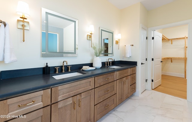 bathroom with vanity and wood-type flooring