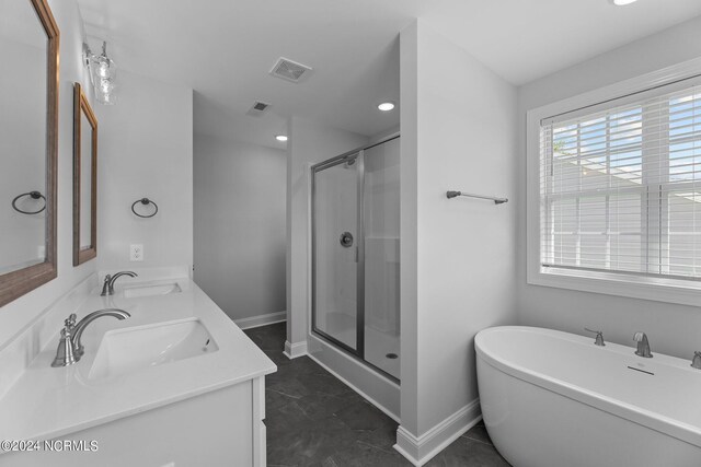 bathroom featuring vanity and plus walk in shower