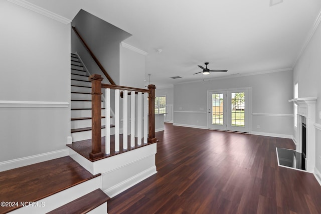 interior space with ceiling fan, dark hardwood / wood-style floors, and crown molding