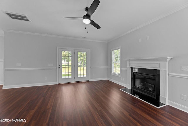 unfurnished living room featuring dark wood-type flooring, ceiling fan, and crown molding