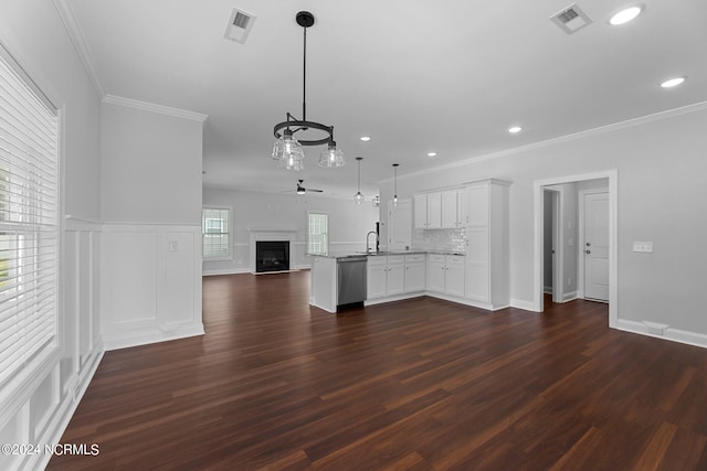 unfurnished living room with ceiling fan, dark hardwood / wood-style floors, crown molding, and sink