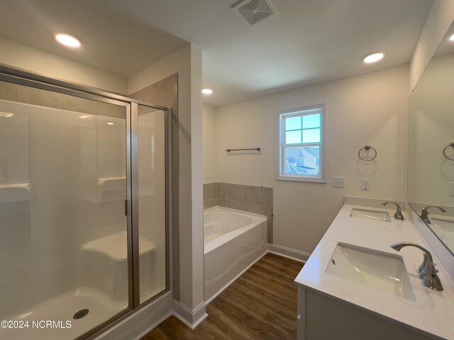 bathroom featuring hardwood / wood-style flooring and shower / washtub combination